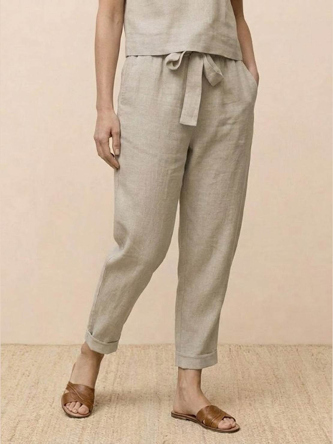 Cotton linen monochrome straight-leg pants with adjustable drawstring waist and natural textured fabric