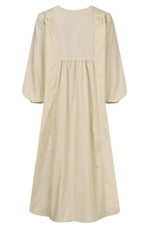 Beige midi long sleeve spring dress with a loose, flowy fit and high neckline.
