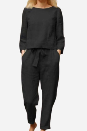 Retro monochrome linen two-piece set with breathable cotton blend, featuring a sleek top and matching pants for comfortable casual style.