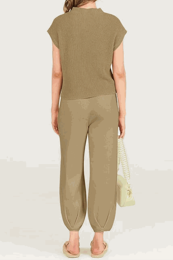 Back view of woman wearing Comfy Couture Knit Sweater two-piece set in neutral color with knit pullover and high-waisted pants.