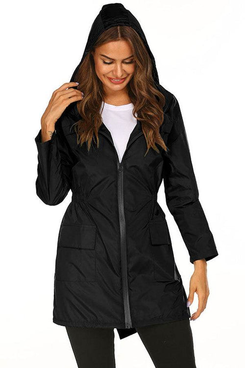 Woman wearing black Outdoor and Travel Hooded Raincoat Windbreaker Jacket with front zipper and hood
