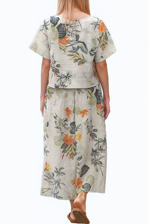 Woman wearing floral print loose fit co-ord set with wide-leg pants and short-sleeve top from the back