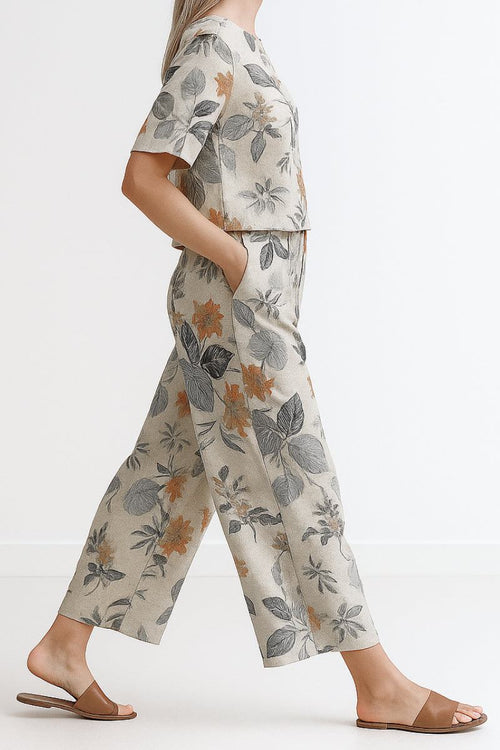 Women's loose fit co-ord set with floral print, wide-leg trousers, and short-sleeve top for relaxed comfort and style