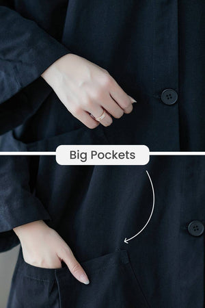 Black oversized water resistant windbreaker jacket with big pockets and button closure