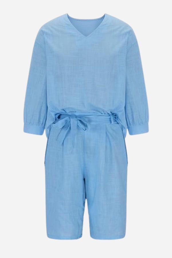 Light blue two-piece set with loose V-neck shirt and high-waisted knee-length shorts made of breathable cotton