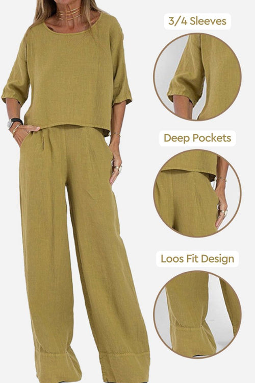 Short-sleeved pullover and wide trouser matching set in mustard yellow with 3/4 sleeves, deep pockets, and loose fit design.