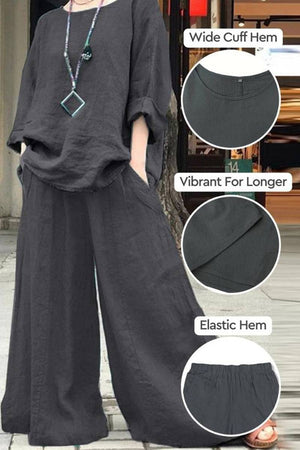 Black wide leg pants with pockets, wide cuff hem, elastic hem, and vibrant color retention