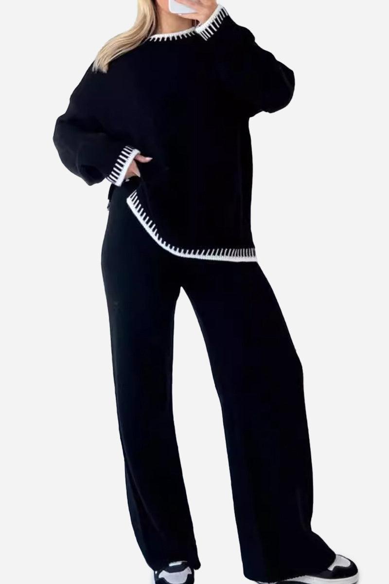 Black Chic Contrast Stitch travel set with white stitch detailing, featuring a loose fit top and wide-leg pants.