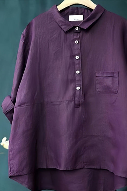 Purple vintage linen shirt with button front and chest pocket on hanger