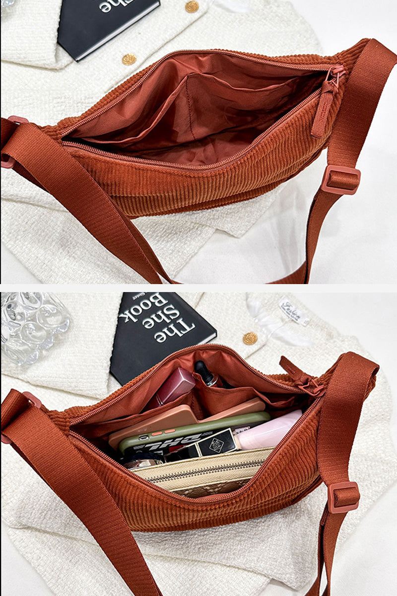 Brown corduroy shoulder bag with adjustable strap and spacious zippered interior compartments