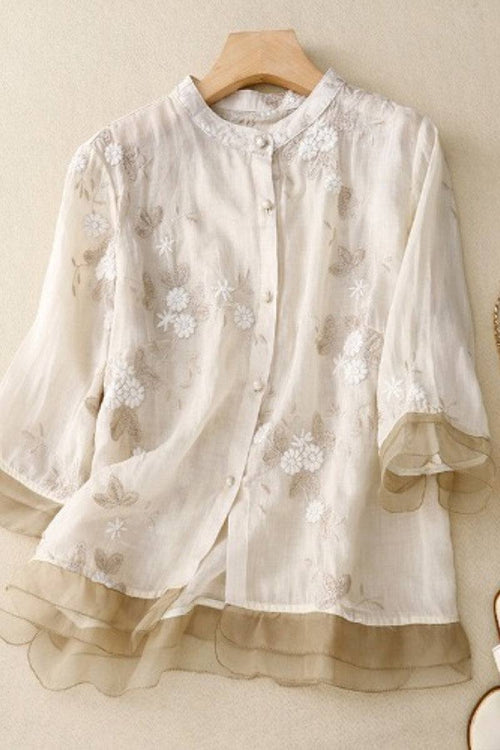 Sheer embroidered cotton linen Tuscany blouse with layered hem and button-up front