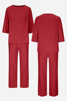 Elegant textured two-piece set in rich burgundy with loose fit top and pants, wrinkle-resistant polyester fabric.