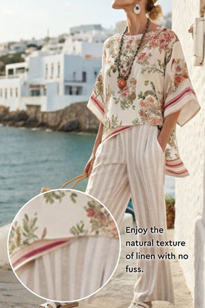 woman wearing Coastal Comfort Linen two-piece set with floral top and striped wide-leg pants by the seaside