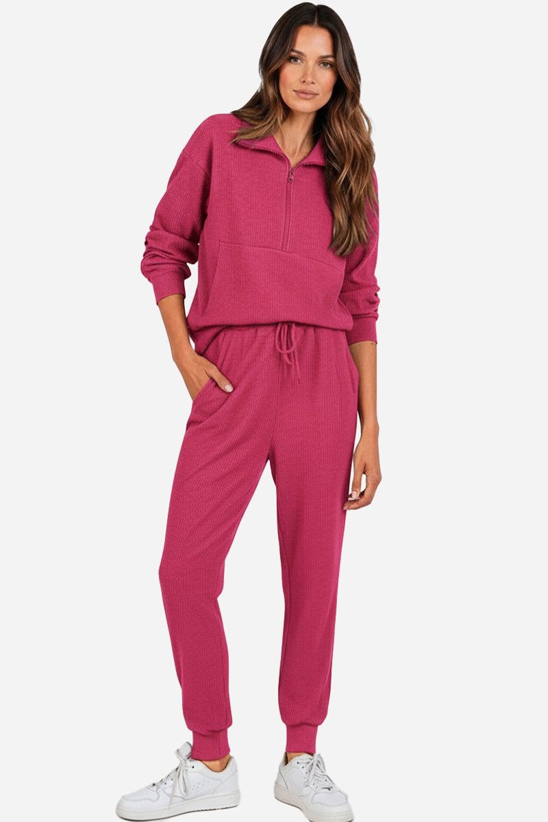 Unisex half-zip pullover and sweatpants set in pink, lightweight polyester blend, casual and comfortable activewear for men and women