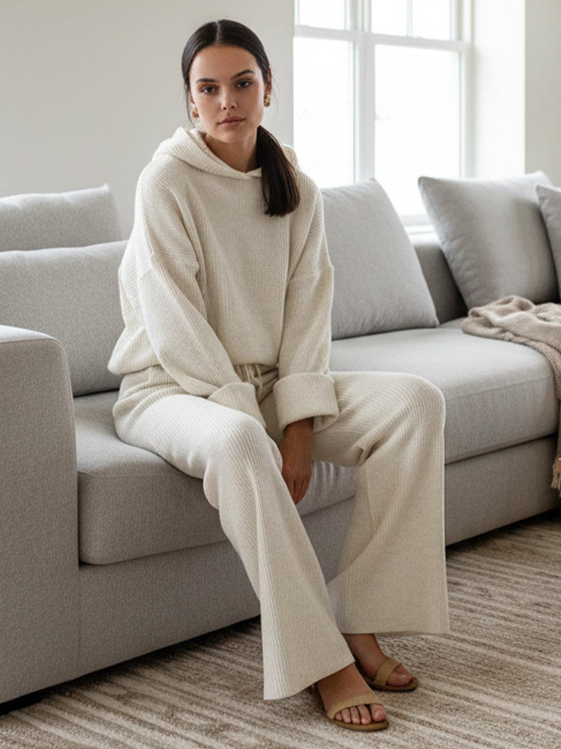 woman wearing beige waffle-knit two-piece set sitting on sofa in bright room