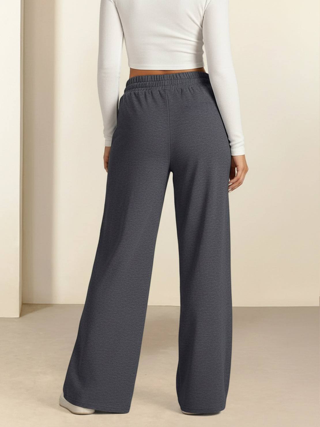 Soft knit wide-leg pants with elastic drawstring waist and functional pockets in breathable fabric