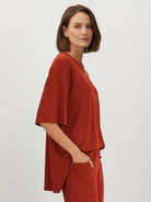 Oversized long-line pullover and wide-leg pants loungewear set in soft knit fabric with elastic waistband and side pockets