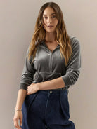 Ultra-soft velvet half-zip hoodie with kangaroo pocket and relaxed fit