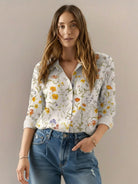 Floral button-down shirt with long roll-up sleeves and relaxed fit