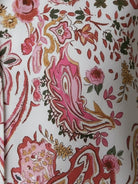 floral button-down shirt with long roll-up sleeves and relaxed hip-length fit