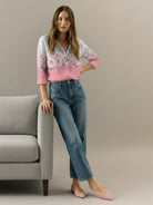 Floral button-down shirt with long roll-up sleeves and relaxed hip-length fit