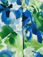 Floral button-down shirt with long roll-up sleeves and hip-length relaxed fit