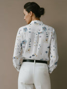 floral button-down shirt with long roll-up sleeves and relaxed hip-length fit