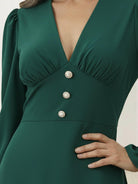 Woman wearing a slimming V-neck midi dress with button-front and ruffle cuffs