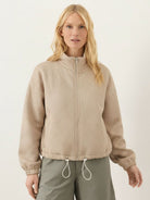 Cropped textured baseball jacket with full zipper, stand collar, elastic cuffs, and waistband, styled for casual wear and layering.