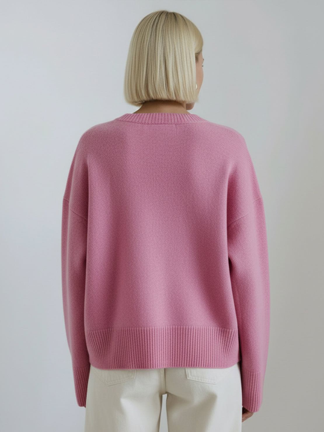 Oversized crew neck knit sweater with drop-shoulder sleeves and ribbed cuffs in neutral color