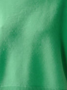 Oversized crew neck knit sweater with drop-shoulder sleeves and ribbed cuffs in neutral color