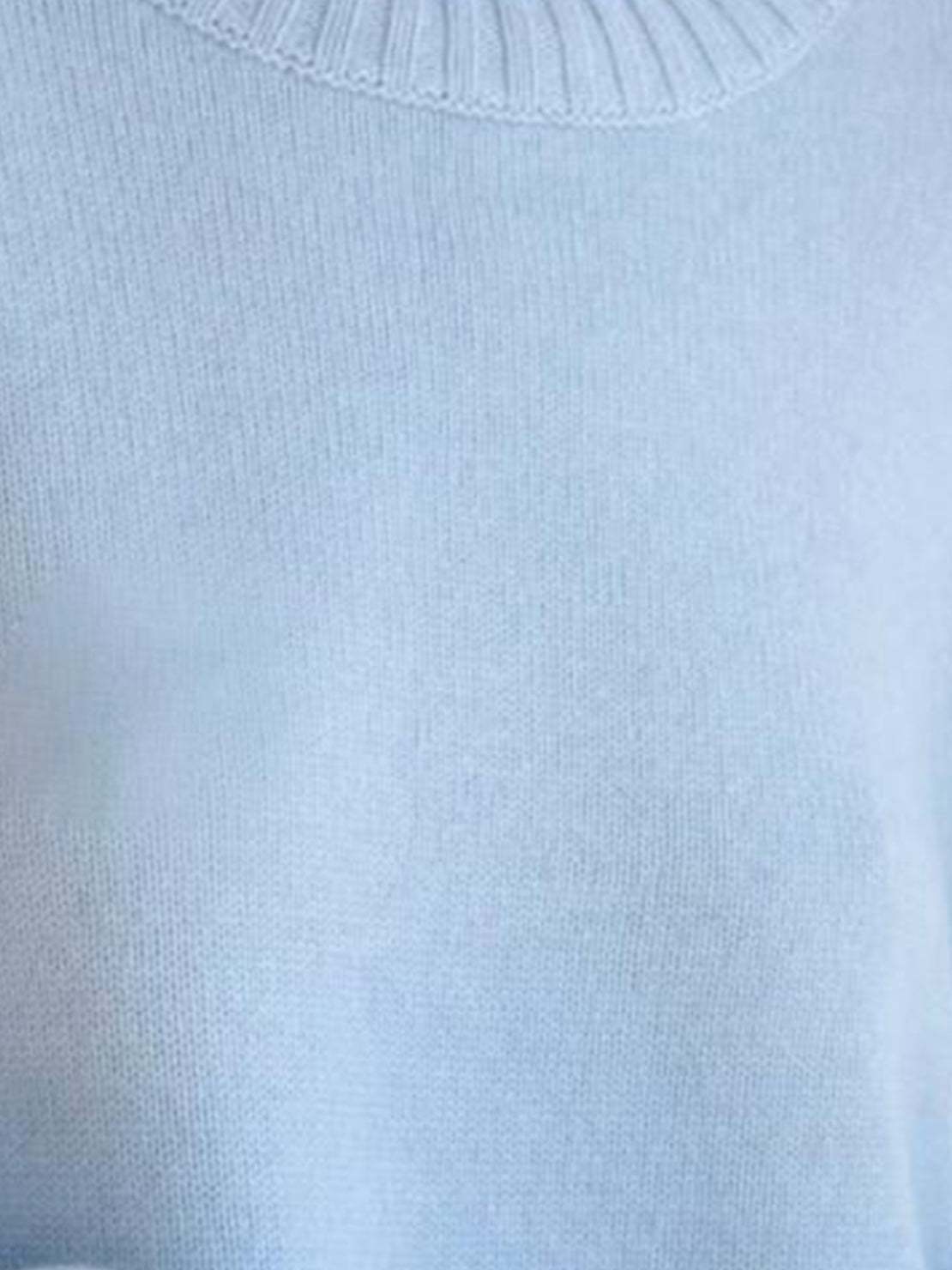 Oversized crew neck knit sweater with drop-shoulder sleeves and ribbed cuffs in neutral color