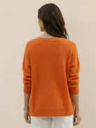 Oversized crew neck knit sweater with dropped shoulders and ribbed cuffs