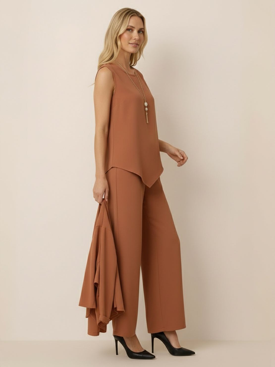 Woman wearing a lightweight open-front three-piece co-ord with longline cardigan, tank top, and wide-leg trousers