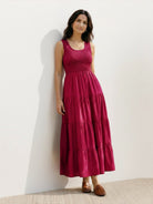 Smocked sleeveless maxi dress with tiered skirt and scoop neckline