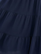 Smocked sleeveless maxi dress with tiered skirt and scoop neckline