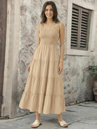 Smocked sleeveless maxi dress with tiered skirt and scoop neckline