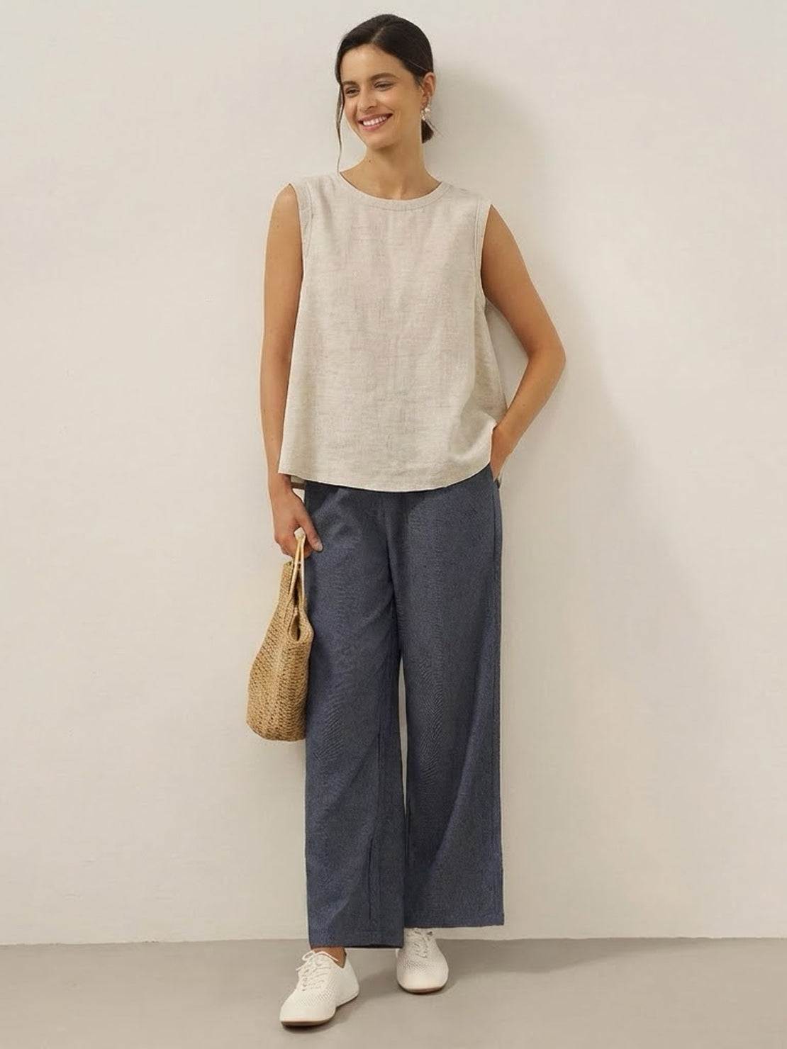 Lightweight 100% cotton-linen sleeveless top with round neckline and back button closure for warm weather layering