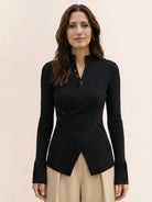 Slim-fit asymmetric wrap ribbed knit top with diagonal button closure and flared cuffs