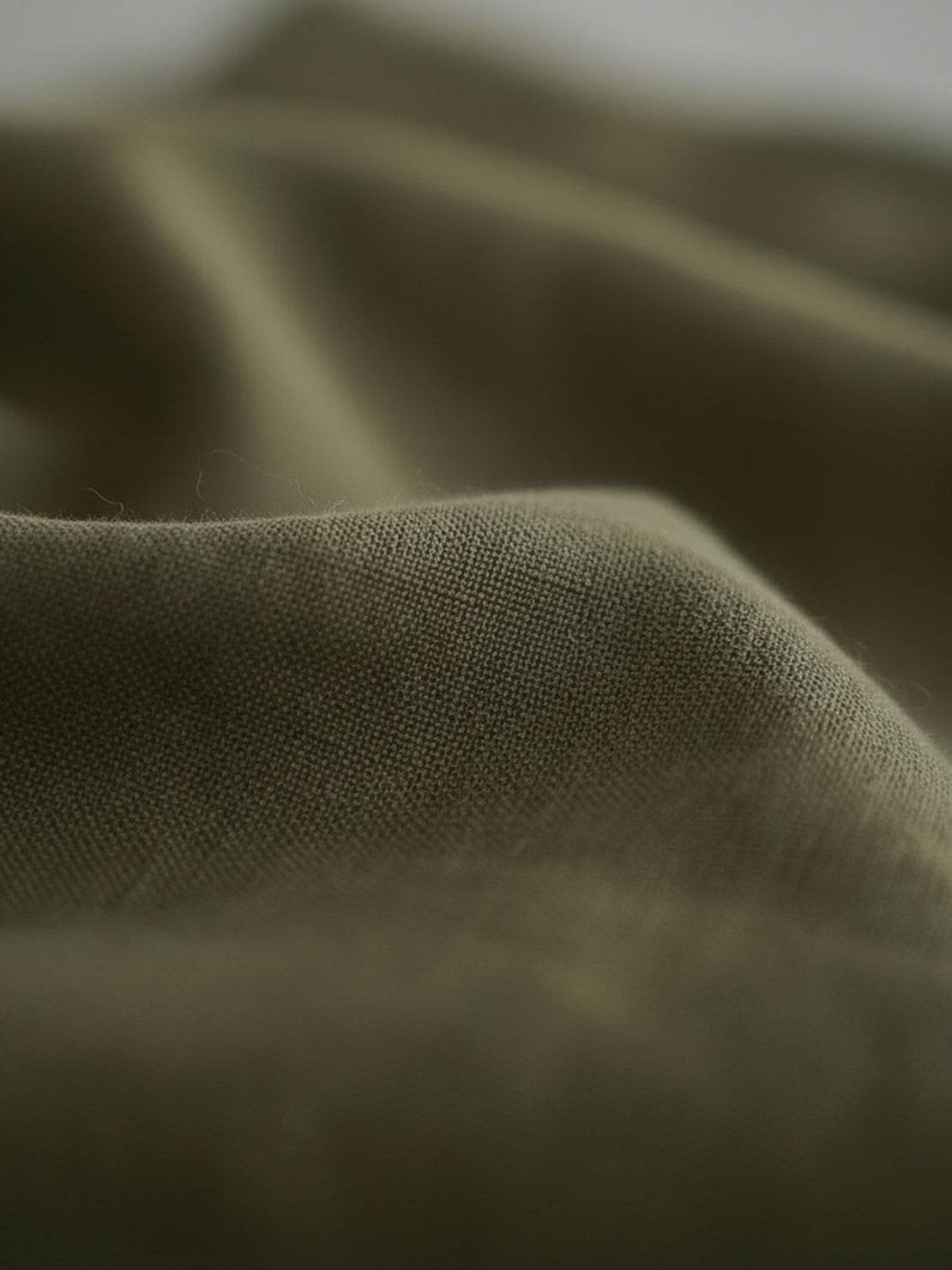 Cotton-linen empire waist dress with natural crinkle texture, maxi length, and side pockets