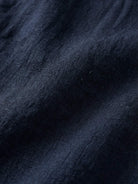 100% cotton artisan two-piece set with oversized shirt and wide-leg pants in natural crinkle texture