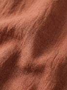 100% cotton artisan two-piece set with oversized button-front shirt and wide-leg elastic waistband pants