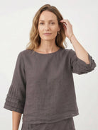 Two-piece 100% cotton wrap-front skirt and hip-length top set with crinkle finish and elastic waistband