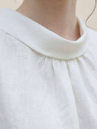100% linen sleeveless cowl-collar top with boxy relaxed fit and natural crinkle texture