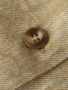 100% linen yarn-dyed vest with fitted shape, square neckline, spaghetti straps, button-front, welt pockets, and curved hem