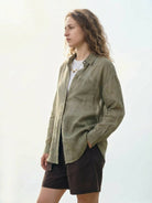 100% linen sheer overshirt with oversized fit, dropped shoulders, and semi-transparent fabric