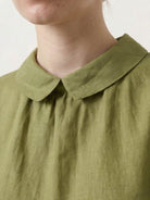 100% linen two-way button blouse with A-line silhouette, Peter Pan collar, and cap sleeves