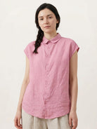 100% linen two-way button blouse with rounded Peter Pan collar and cap sleeves in relaxed A-line silhouette