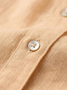 100% linen V-neck shirt with relaxed fit and long sleeves