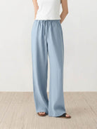 100% linen wide-leg pants with high-rise elastic waistband and side pockets